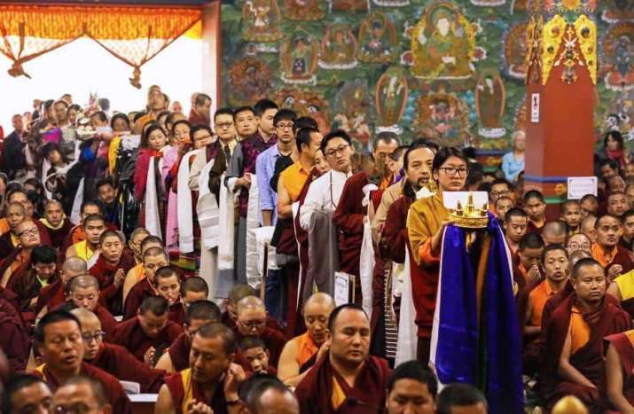Khandro Tashi Chotso leading the line with offerings. From Dilgo Khyentse Fellowship - Shechen Facebook
