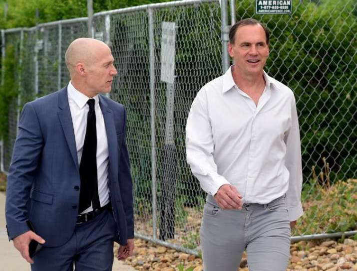 Michael Smith, right, arrives at court with his attorney. Image from dailycamera.com