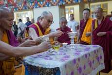 The Dalai Lama lights a butter lamp on Vesak in 2016. From dalailama.com