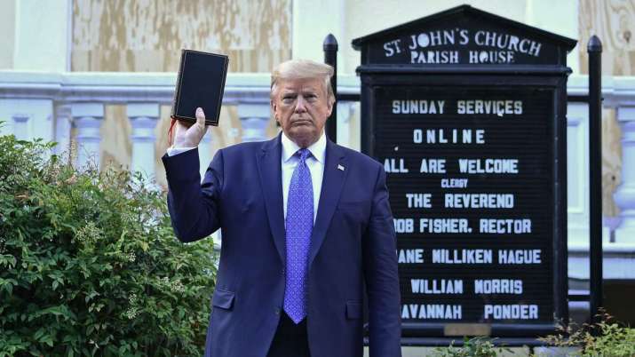 Donald Trump holds up a Bible at St. John's Church in Washington, DC. From axios.com