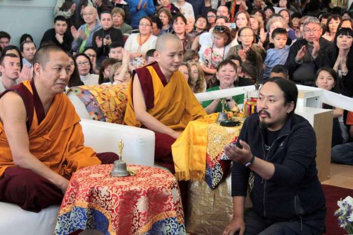 Mitruev interpreting during the teaching by Kudeling Rinpoche in Moscow. Image courtesy of Bem Mitruev