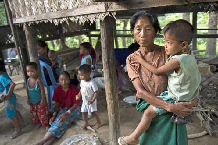 A displaced resident, a member of the Myo ethnic group, with her child at a Buddhist monastery in Kantharyar village in Rakhine State. From refworld.org