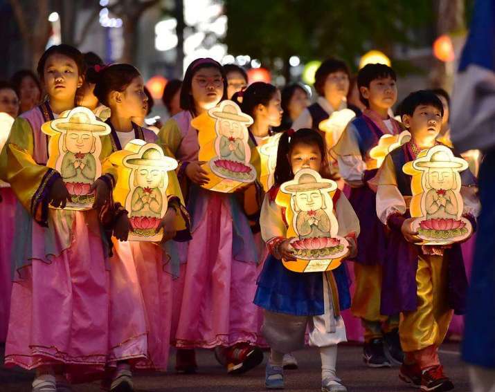 Children join the parade of light with Buddha-shaped lanterns. From ich.unesco.org