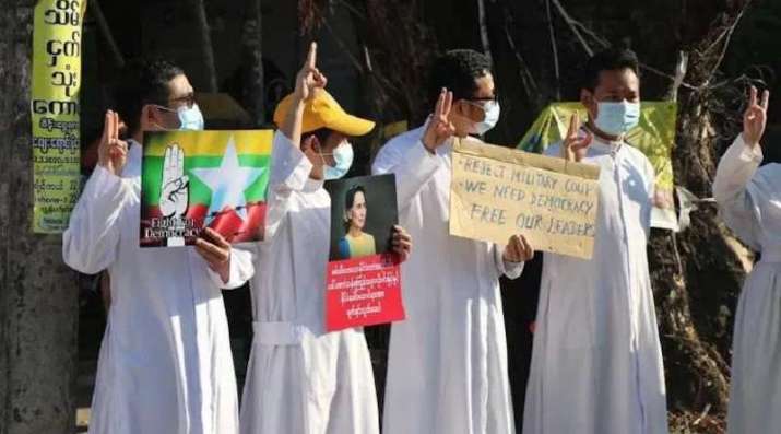 Catholic priests hold a picture of State Counselor Aung San Suu Kyi during an anti-coup protest in Pathein, Irrawaddy Division, on 10 February. From eurasiareview.com