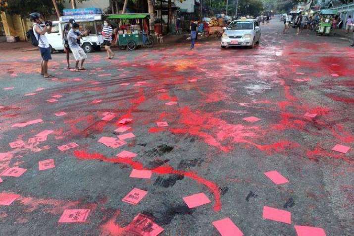 Red paint and flyers in Yangon promote a student-led “Red Movement” in protest against the military coup. From mizzima.com